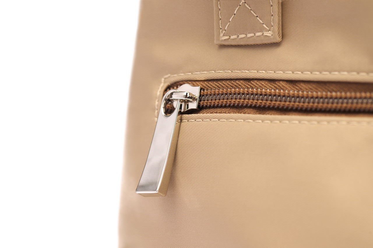 STÆRKE mini gym bag back zipper detail, beige recycled nylon with silver hardware