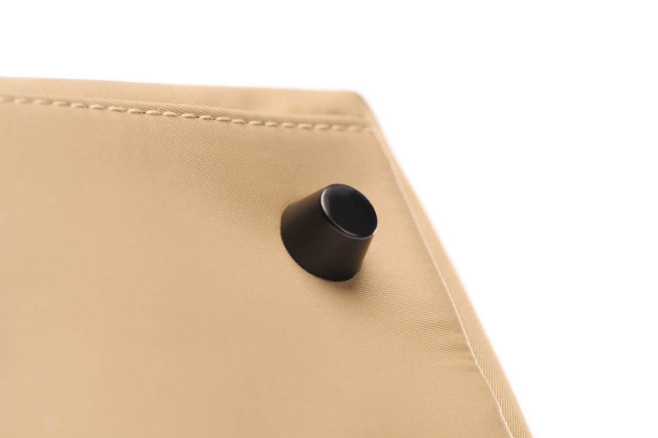 STÆRKE mini gym bag protective base stud detail on beige recycled nylon