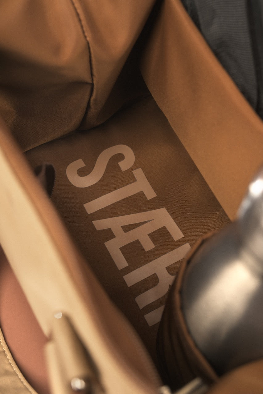 STÆRKE mini gym bag interior branding logo detail on beige lining